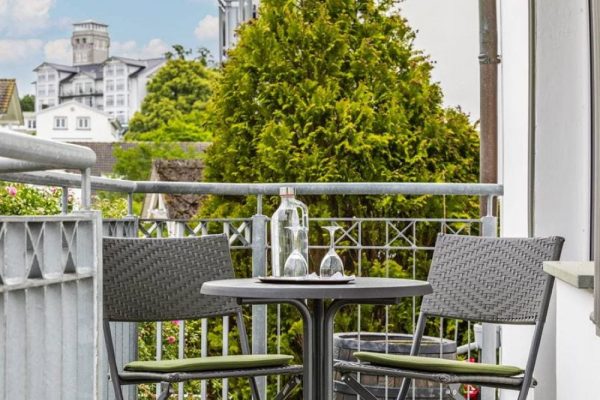 Balcony with outdoor seating in the suite at Hotel Stranddistel in Goehren, Ruegen Island