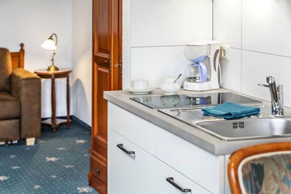 Pantry kitchen in the modernized, fully equipped suite at Hotel Stranddistel in Goehren, Ruegen Island