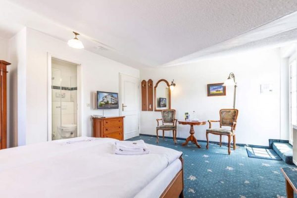 Book a double room with sloping ceilings at Hotel Stranddistel in Goehren, Ruegen Island